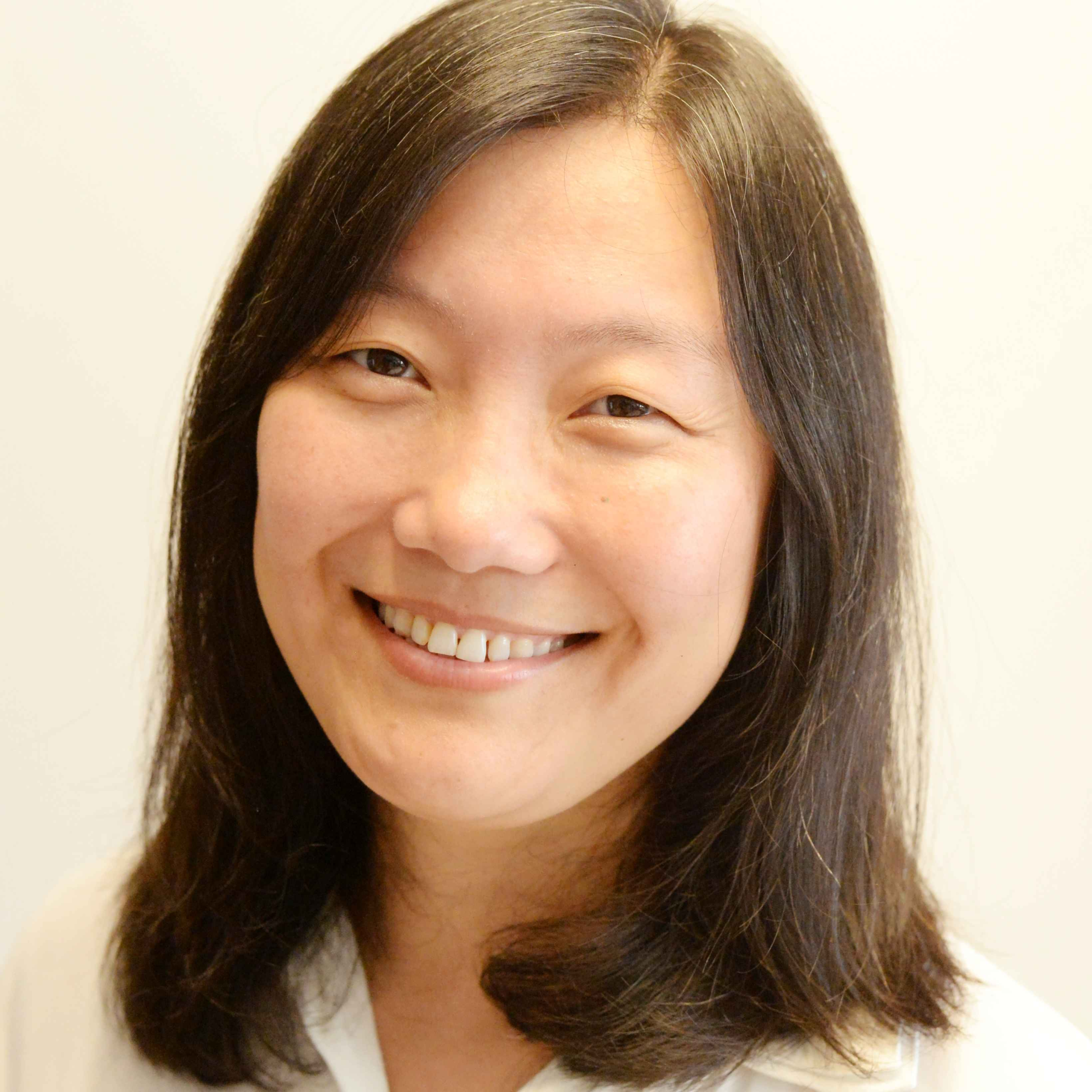 Experienced acupuncturist Yi Qu specializing in holistic care.